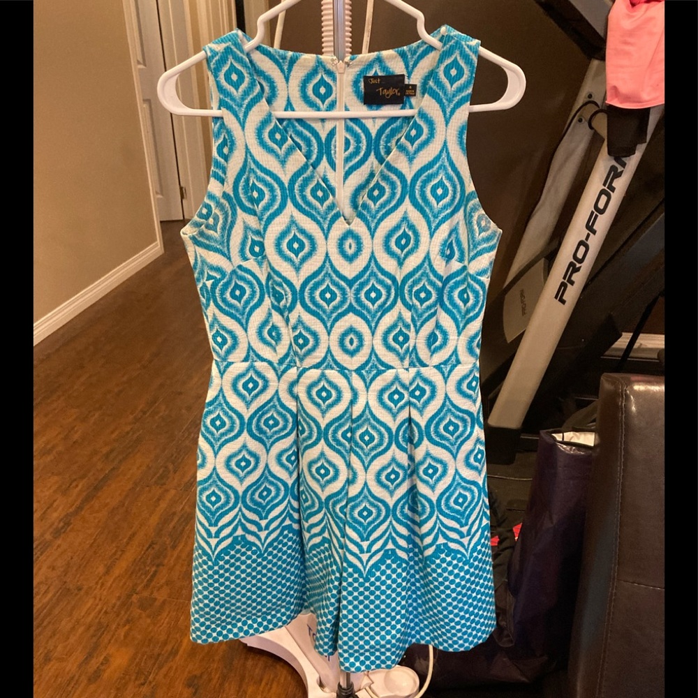White and teal sleeveless fit and flair dress